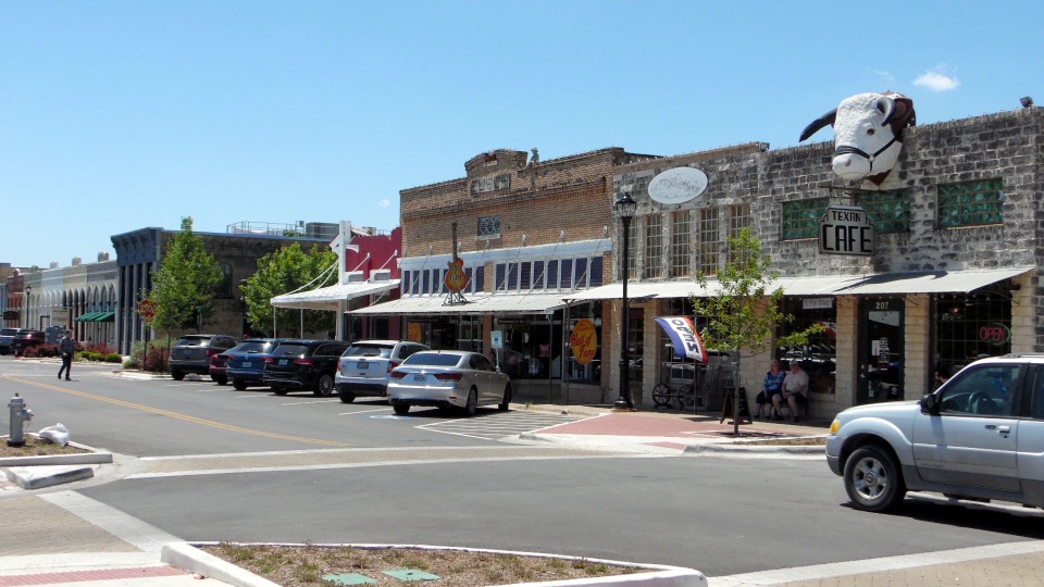 Historic storefronts, sidewalks and street in downtown Hutto, Texas